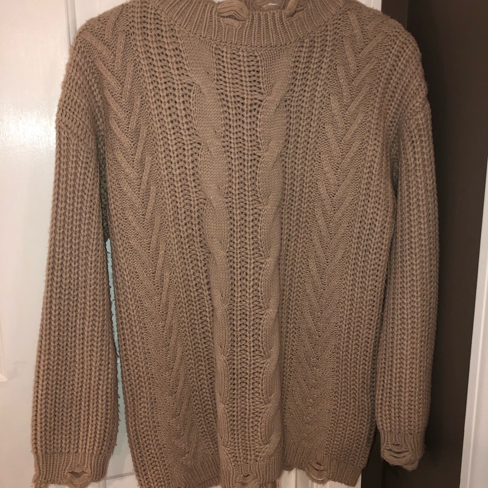 Distressed chunky cable knit sweater